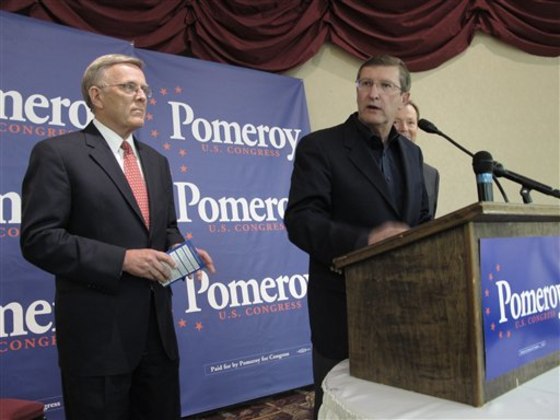 Sen. Kent Conrad, D-N.D., who announced on Tuesday he would not run for re-election in 2012, speaks at a campaign rally for Rep. Earl Pomeroy, D-N.D., on Oct. 13, 2010. Pomeroy, partially blocked at far right, lost in November to Republican Rick Berg, and Democratic U.S. Sen. Byron Dorgan, left, did not seek re-election and left the Senate this month.
